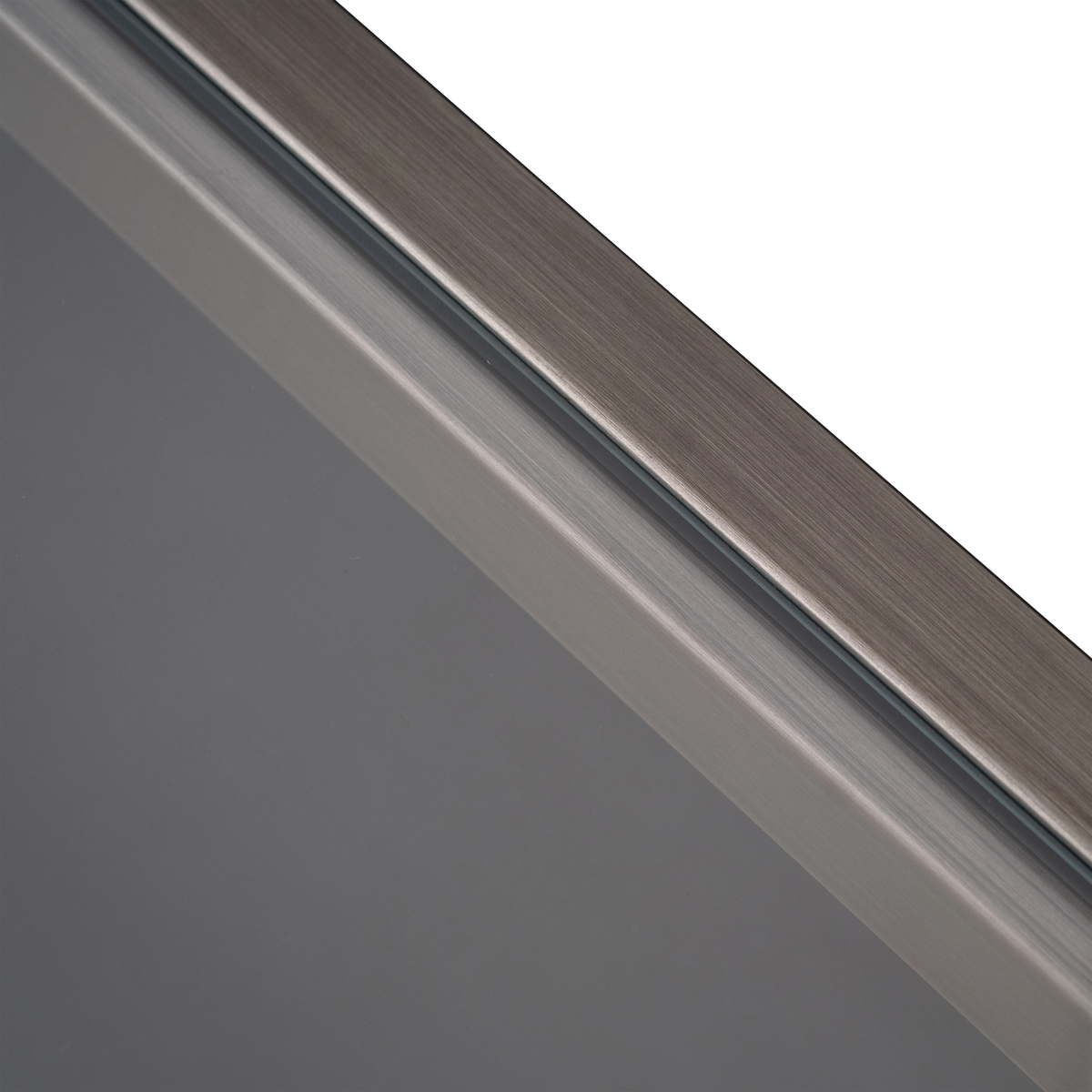 Close-up of the crisscross stretcher on the Tenor Console Table in Aged Pewter, showing the brushed grain and the notched joint where the two bars cross.