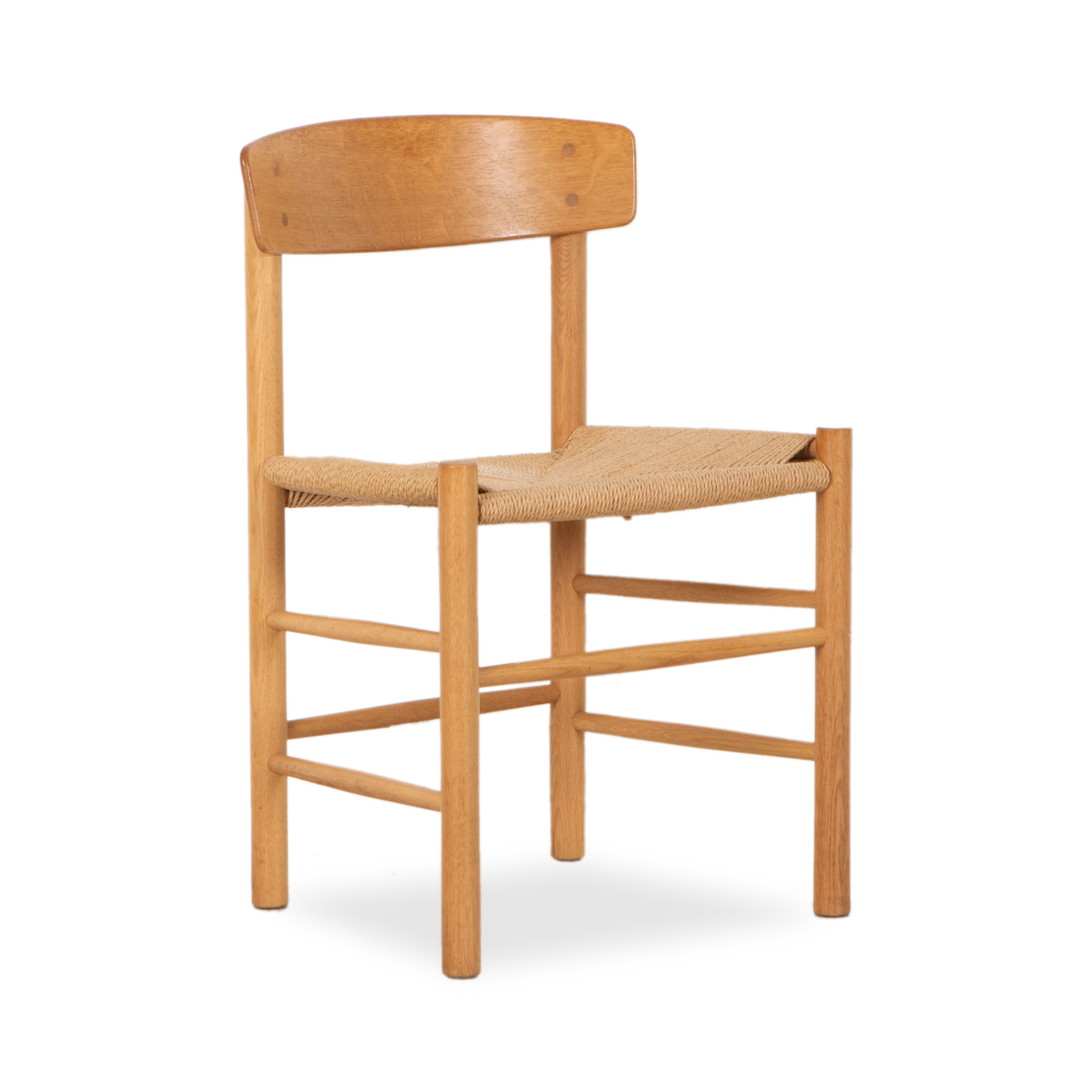 A display of fine craftsmanship, this vintage J39 Chair was designed by Borge Mogensen and manufactured by Fredericia Stolefabrik, circa 1940s.
