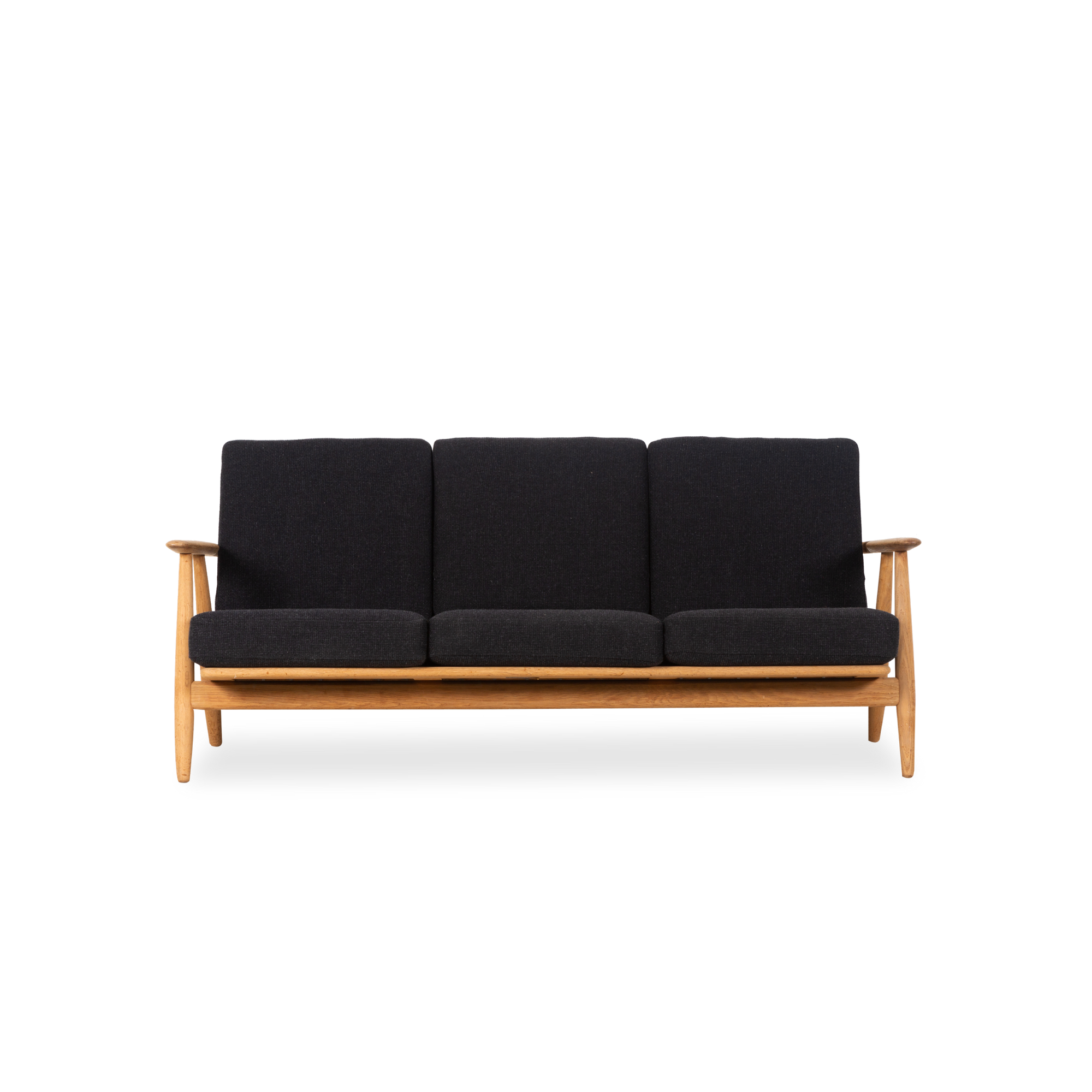 An icon of Danish design, this vintage GE-240 Cigar Sofa was designed by Hans Wegner and manufactured by GETAMA, circa 1950s.