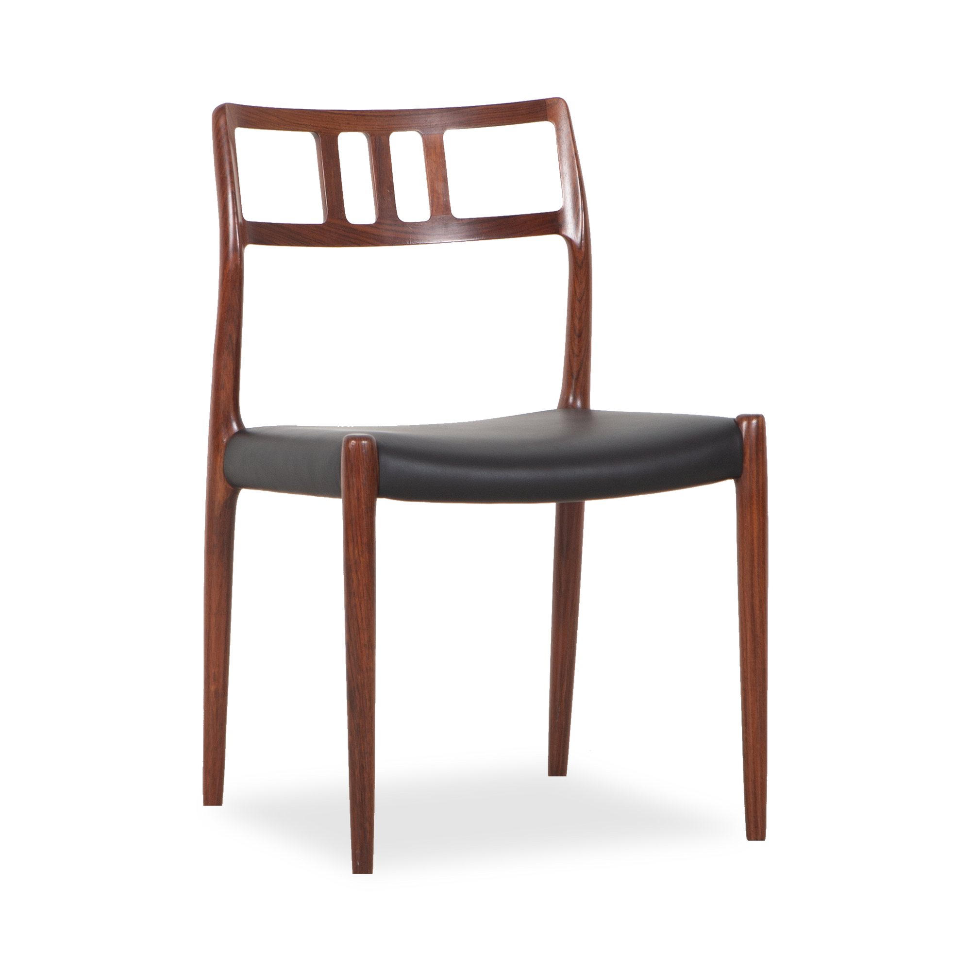 Embodying iconic Scandinavian design structures, this vintage Model 79 Chair was designed by Niels Otto Moller and manufactured by J.
