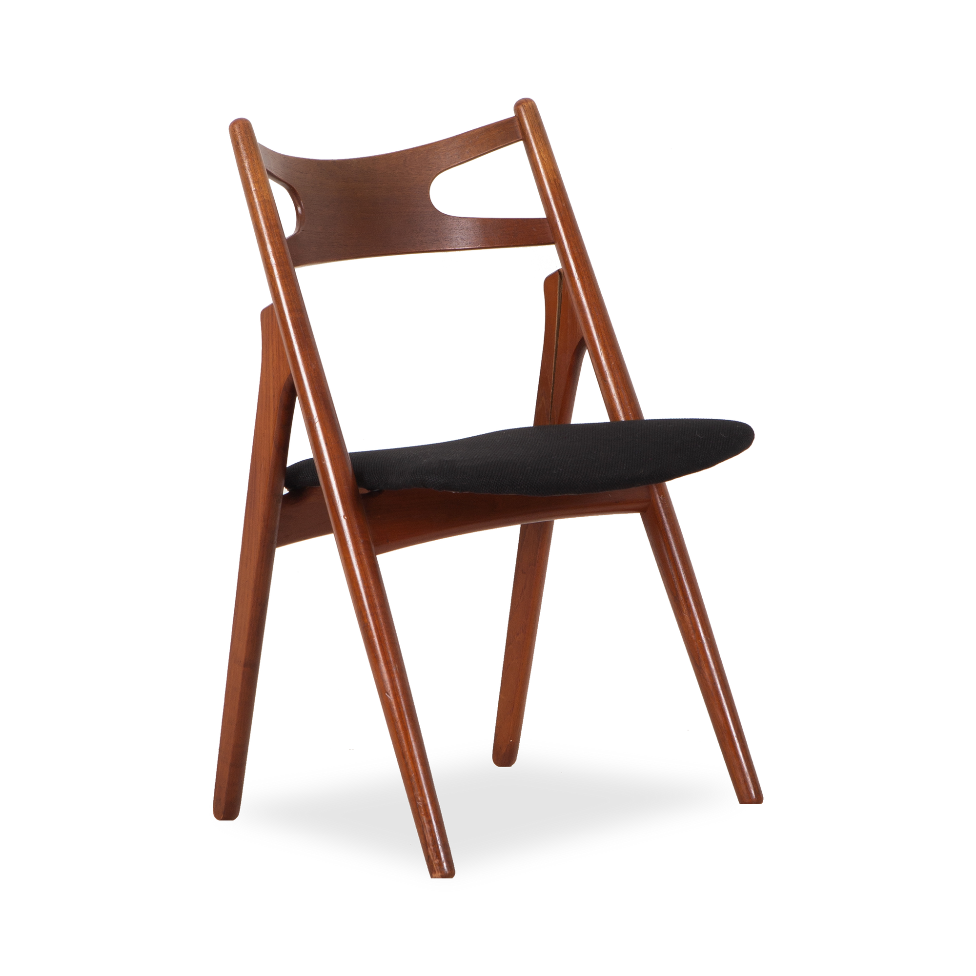 An iconic mid-century chair, this vintage CH-29 Sawbuck Chair was designed by Hans Wegner and manufactured by Carl Hansen and Son.