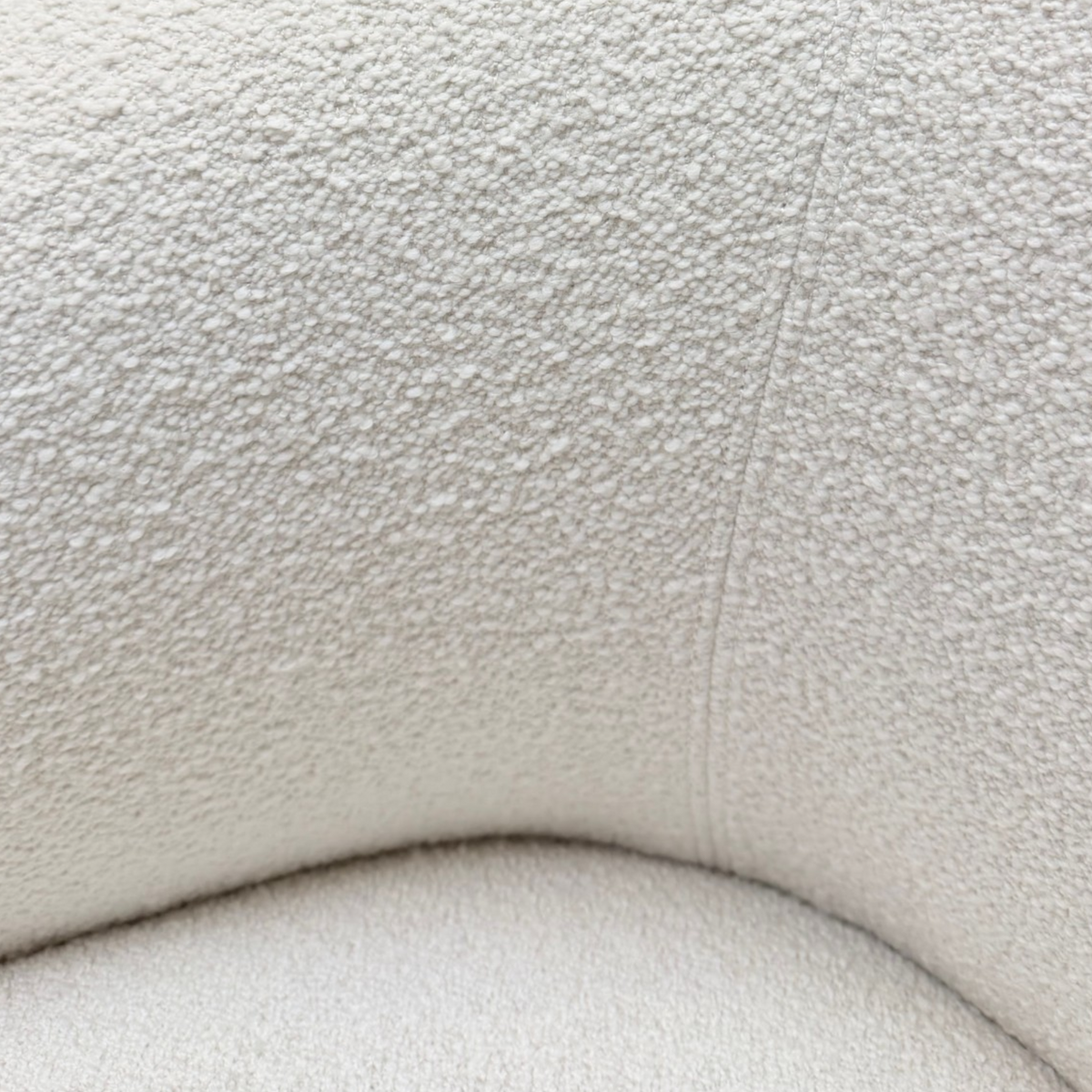 Interior detail of Arcus Swivel Chair highlighting the curved backrest, seat and finely textured Grey Oak fabric.