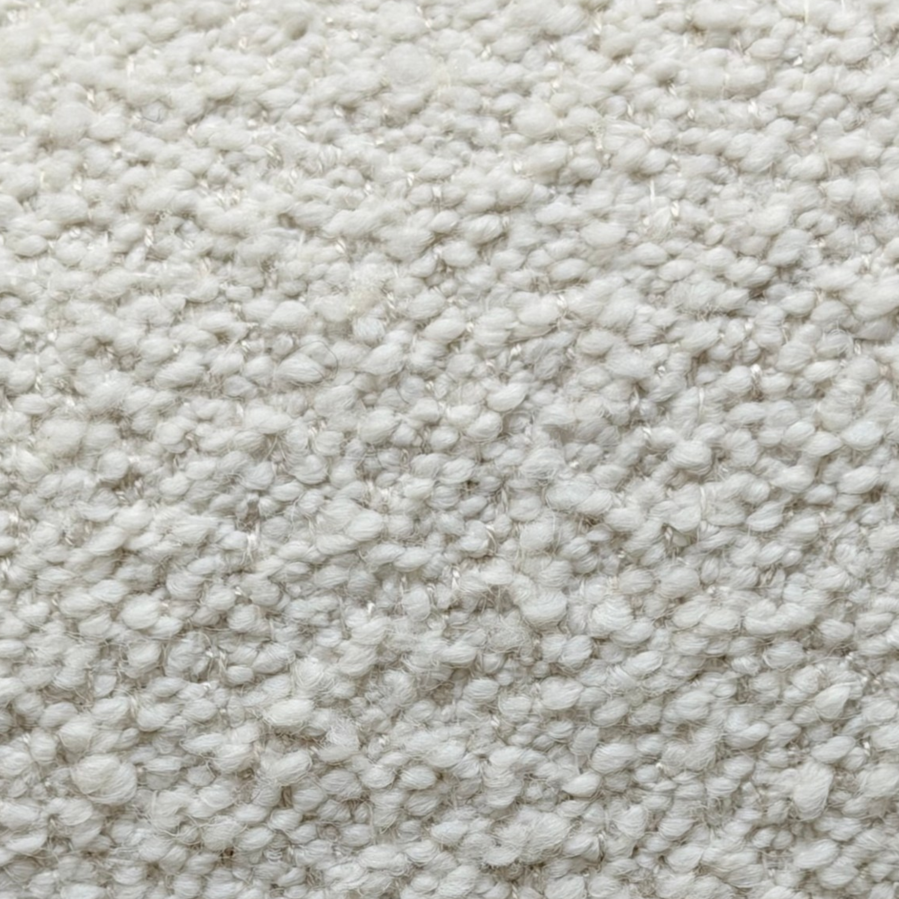 Close-up of Grey Oak upholstery showing the soft, nubby woven texture used on the Arcus Swivel Chair.
