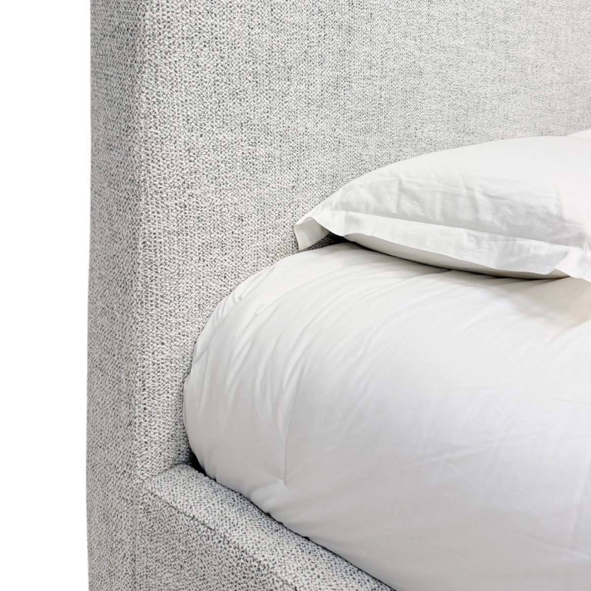 Close-up of the Vital King Bed headboard and side rail, highlighting the textured grey-and-ivory upholstery beside white bedding.
