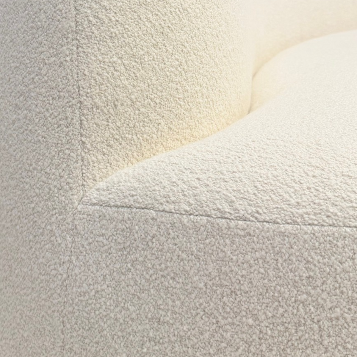 Rhine 120" Sofa in ivory bouclé, close-up view showing the textured upholstery and curved seat and backrest.