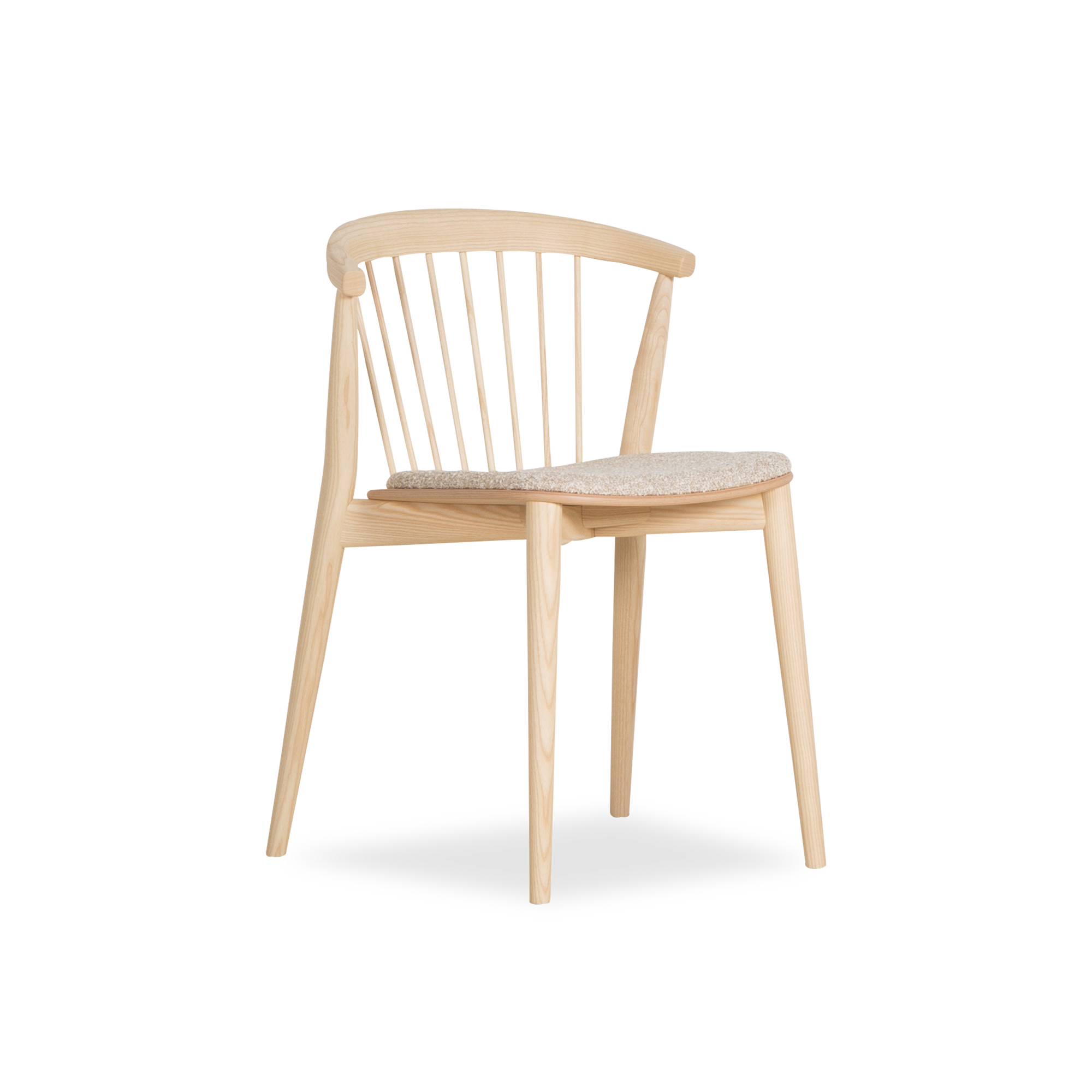 The Newood chair represents a contemporary reinterpretation of the timeless charm found in Windsor-style chairs.