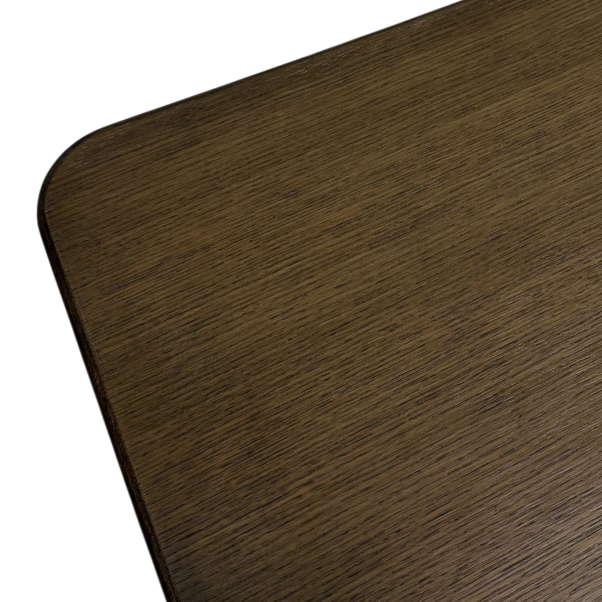 Detail view of the Altar 120-inch Dining Table highlighting the rich dark wood grain, smooth finish and gently rounded tabletop corner.