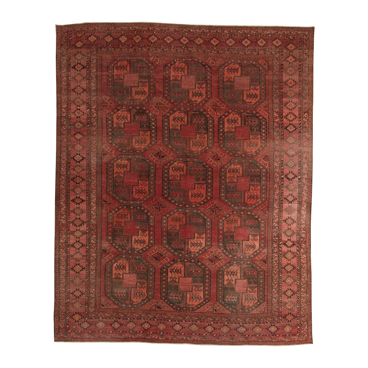 A traditional oriental area rug with a geometric pattern in shades of red, brown, and dark green, shown flat against a white background.