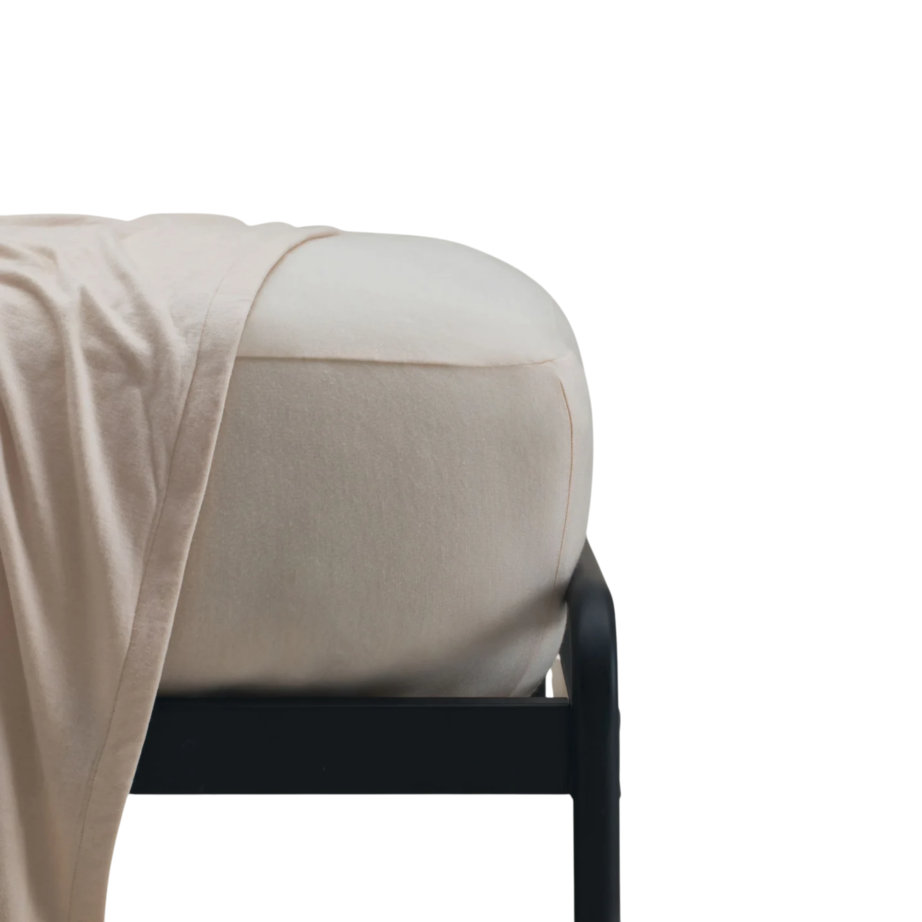 Merino Fit Sheet King in Ivory Merino Jersey shown fitted over a mattress with coordinating bedding draped over the edge.