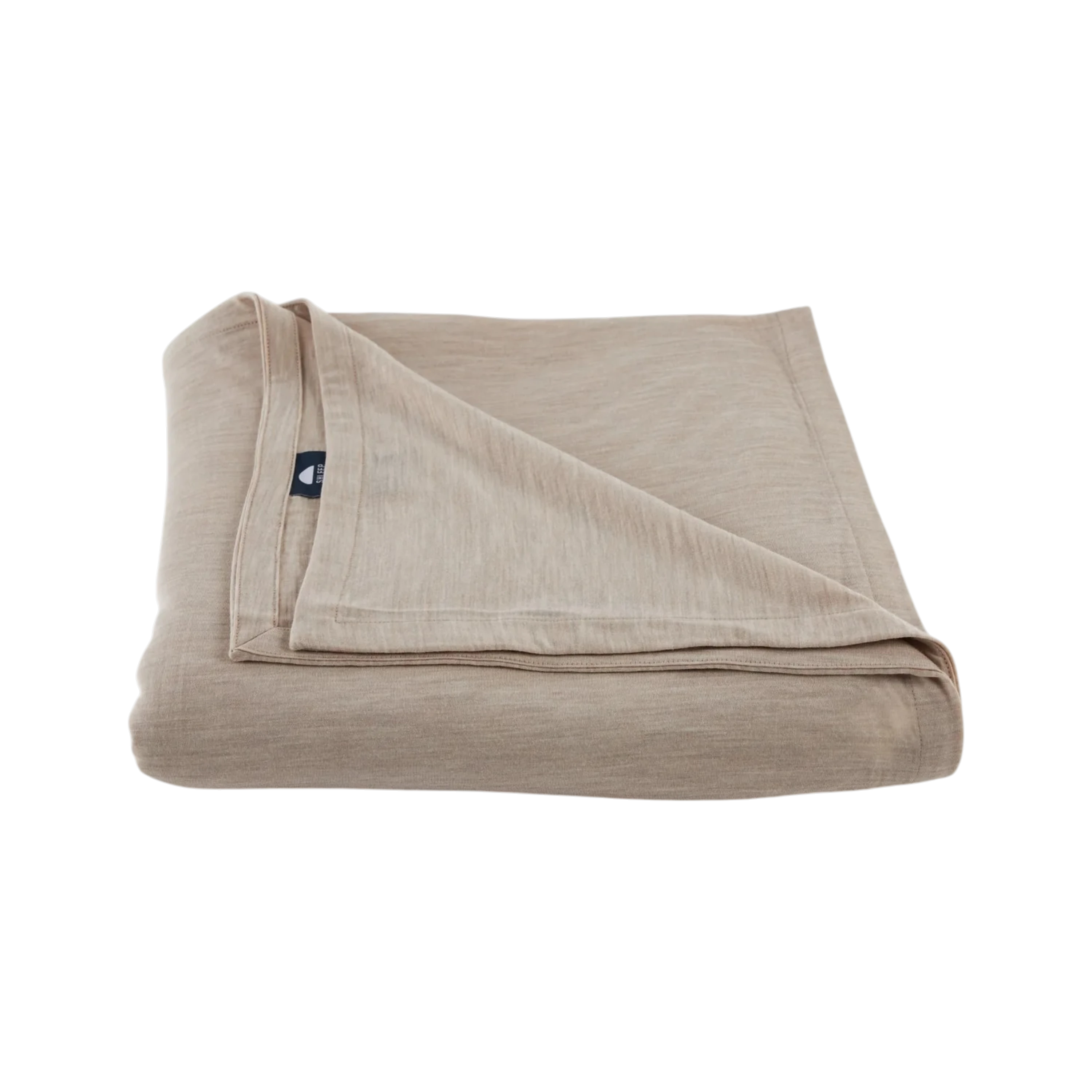 Merino Flat Sheet Queen in Sand Merino Jersey, folded to show the soft drape, double-layered top edge and stitched finish.