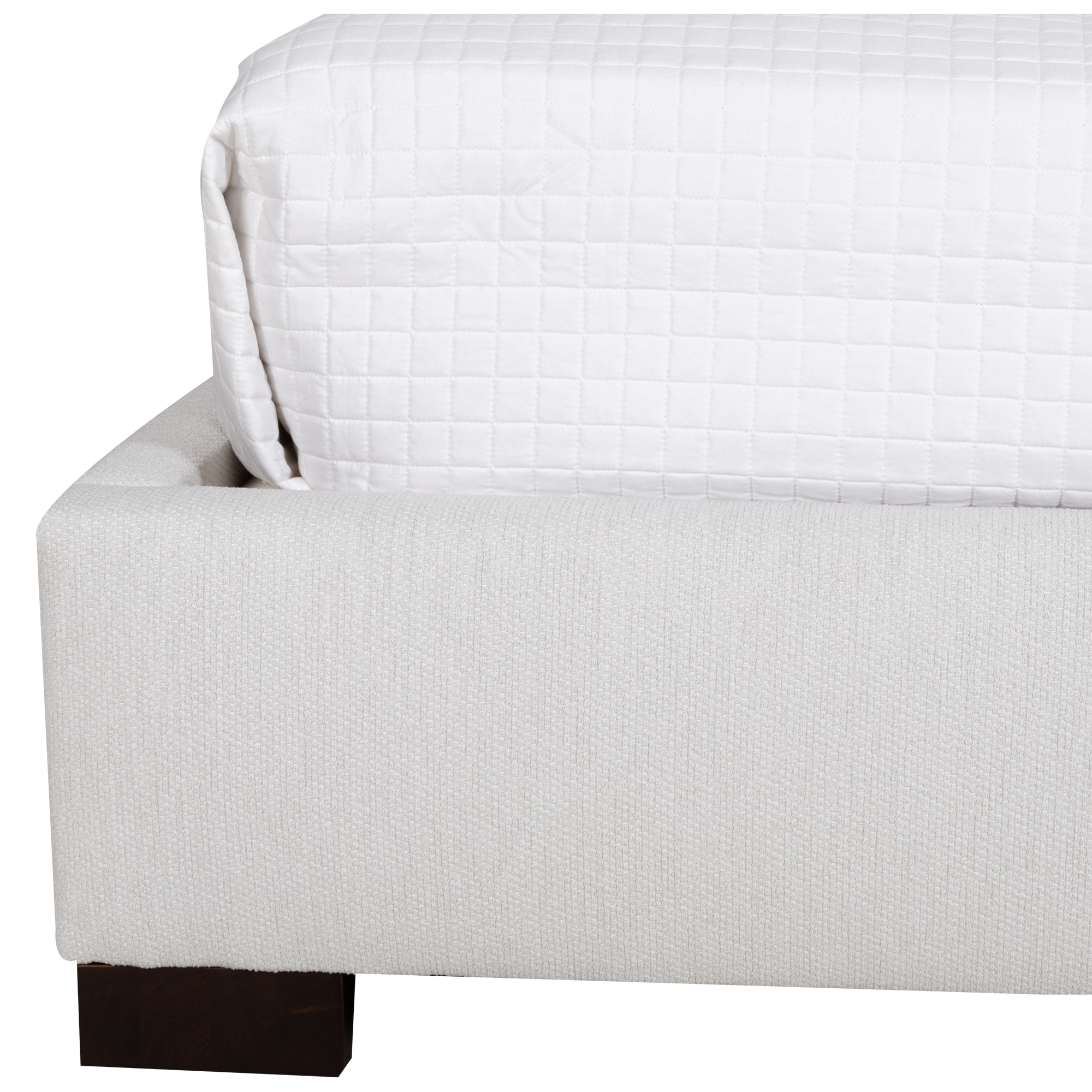 Upholstered in a luxurious light grey fabric, the Raffi Bed makes a bold statement with clean lines and plush styling.