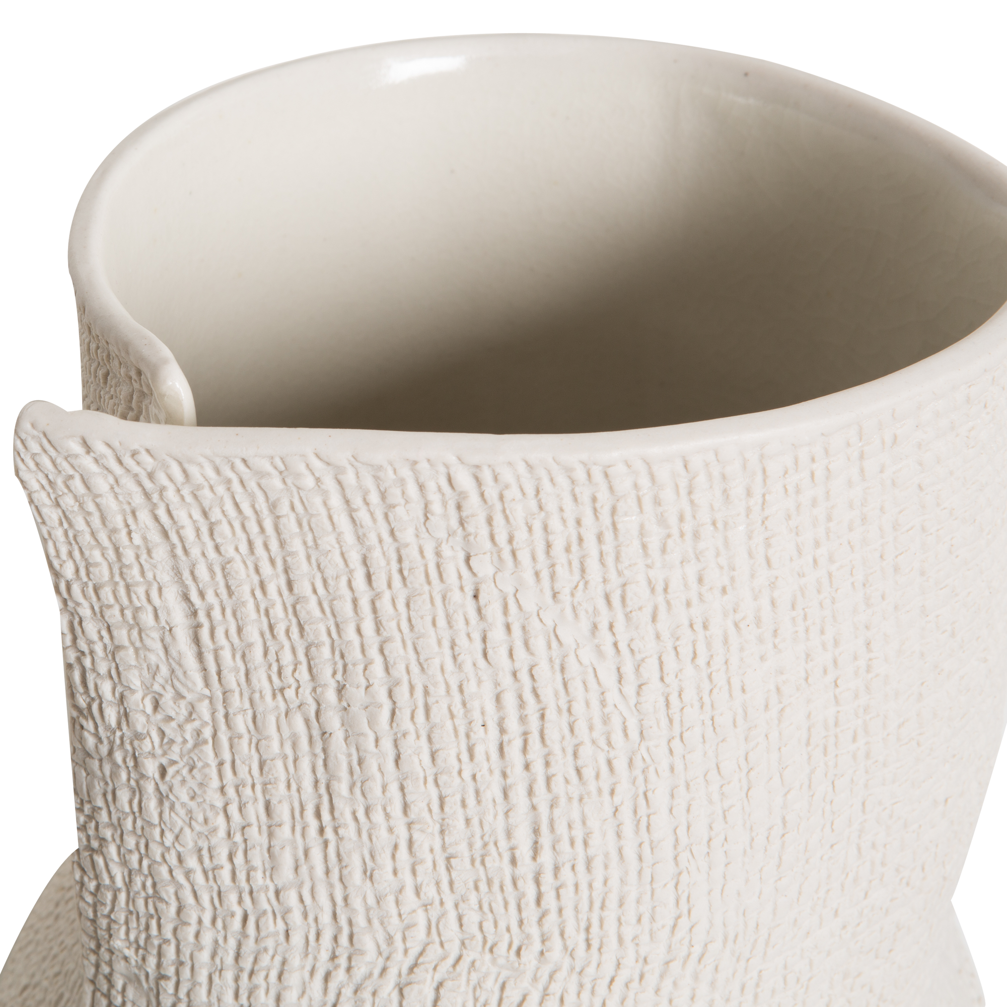 Embracing the beauty of imperfection, the Burlap Bottle Vase is uniquely textured and this intentionally imperfect vase was handcrafted using vitreous high-fire, pure porcelain.