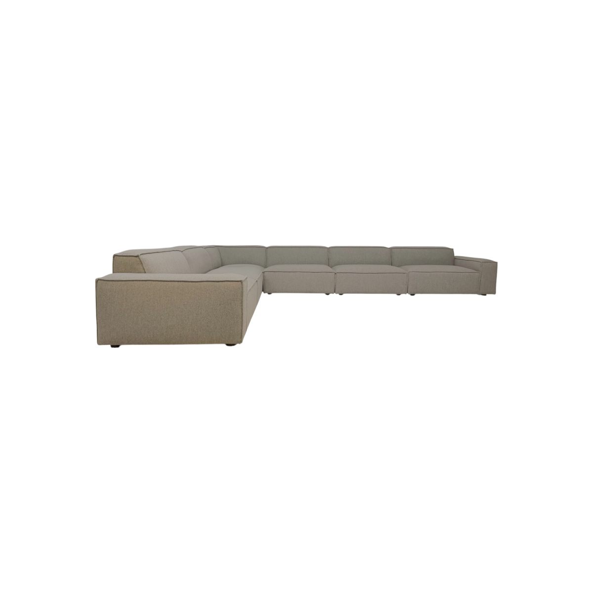 Vetro Modular Sectional shown from the front in a low-slung L-shaped layout with oversized cushions and textured heathered taupe fabric.