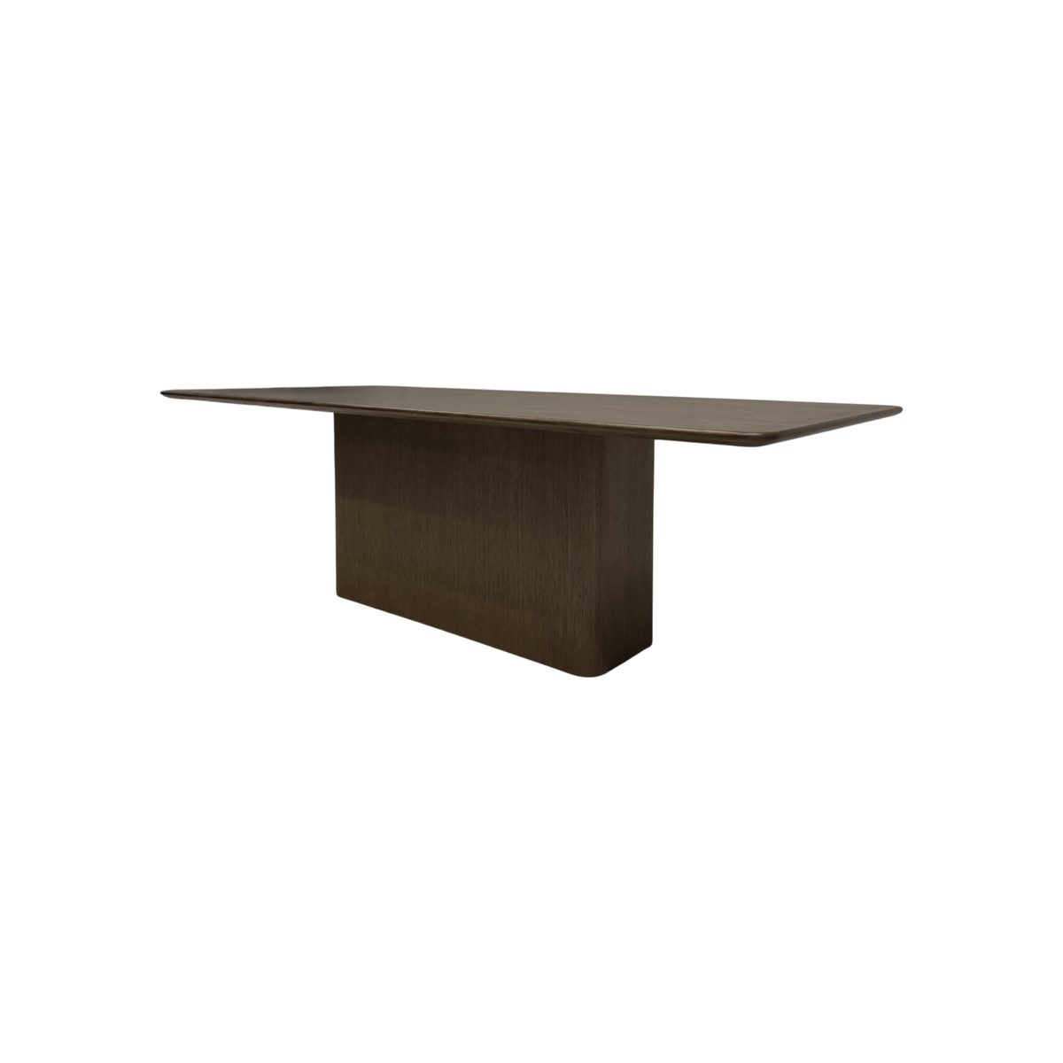 Angled view of the Altar Dining Table showing its elongated wood top, gently softened corners and architectural pedestal base.