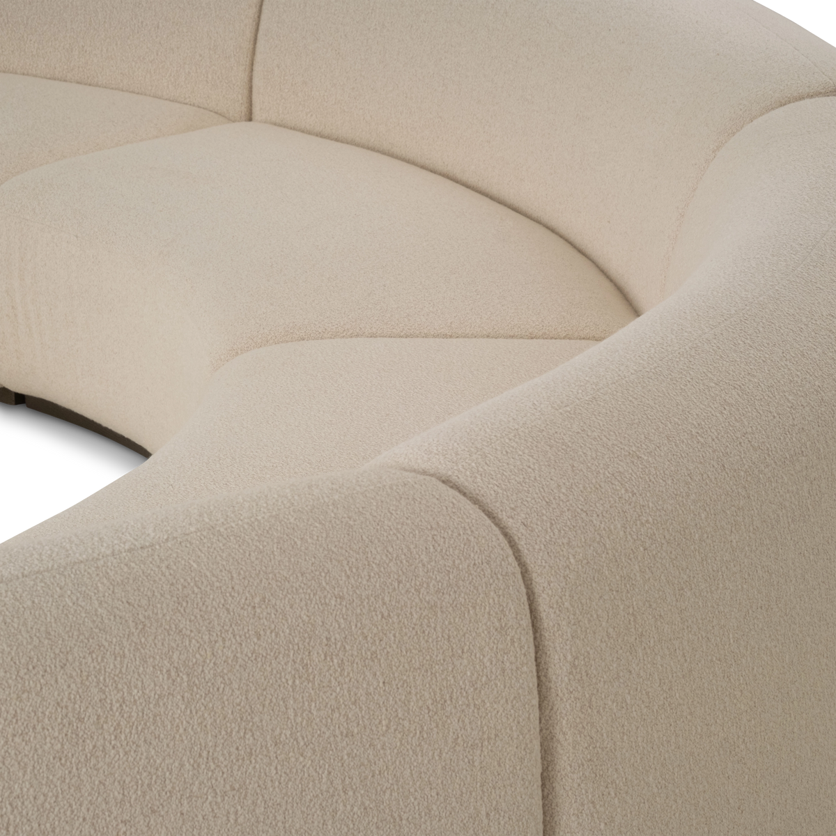 Close-up of the Rhine Modular Sectional Sofa upholstery in cream bouclé, showing the chunky ivory loops woven over a warm beige base.