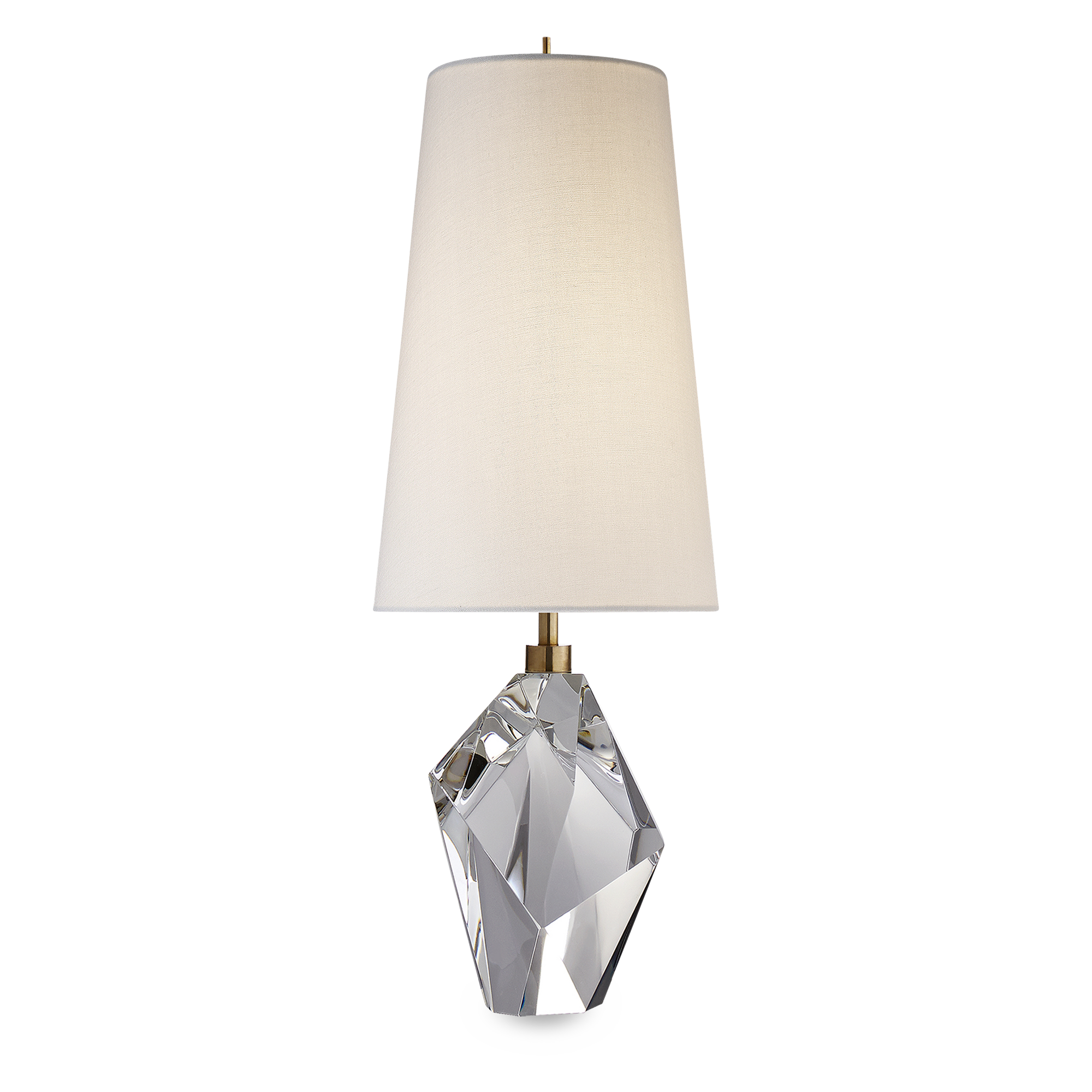 The stunning Halcyon lamp features a slender linen shade atop a spectacular crystal base which reflects light at all angles and has an undeniably radiant quality.