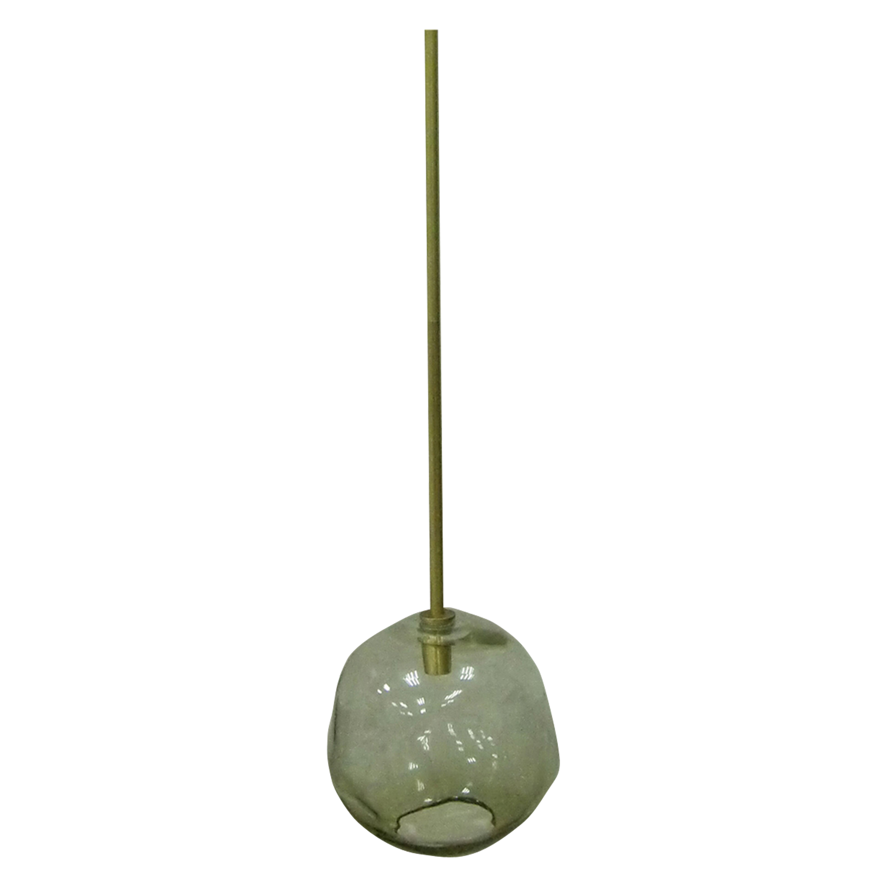 A smoked glass orb with an organic, irregular silhouette hangs from a brass rod in this elegant and natural pendant.