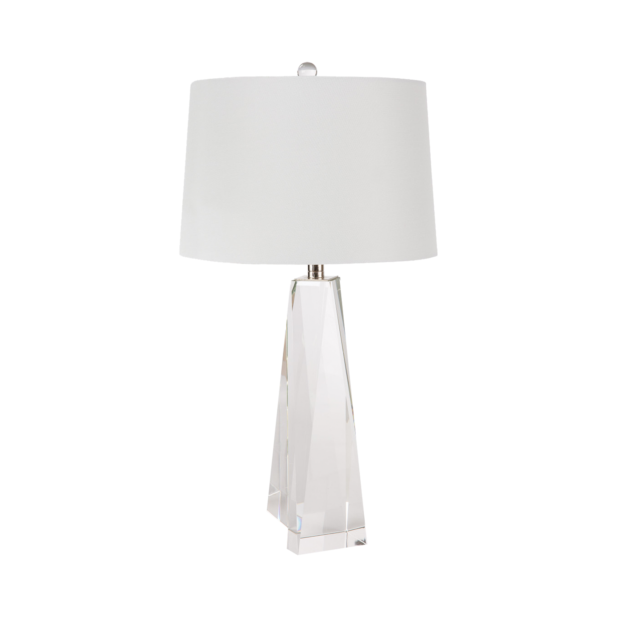 The Tapered Crystal Table Lamp is crafted of solid hand polished crystal, fitted with polished nickel hardware and topped with a natural linen tapered shade.