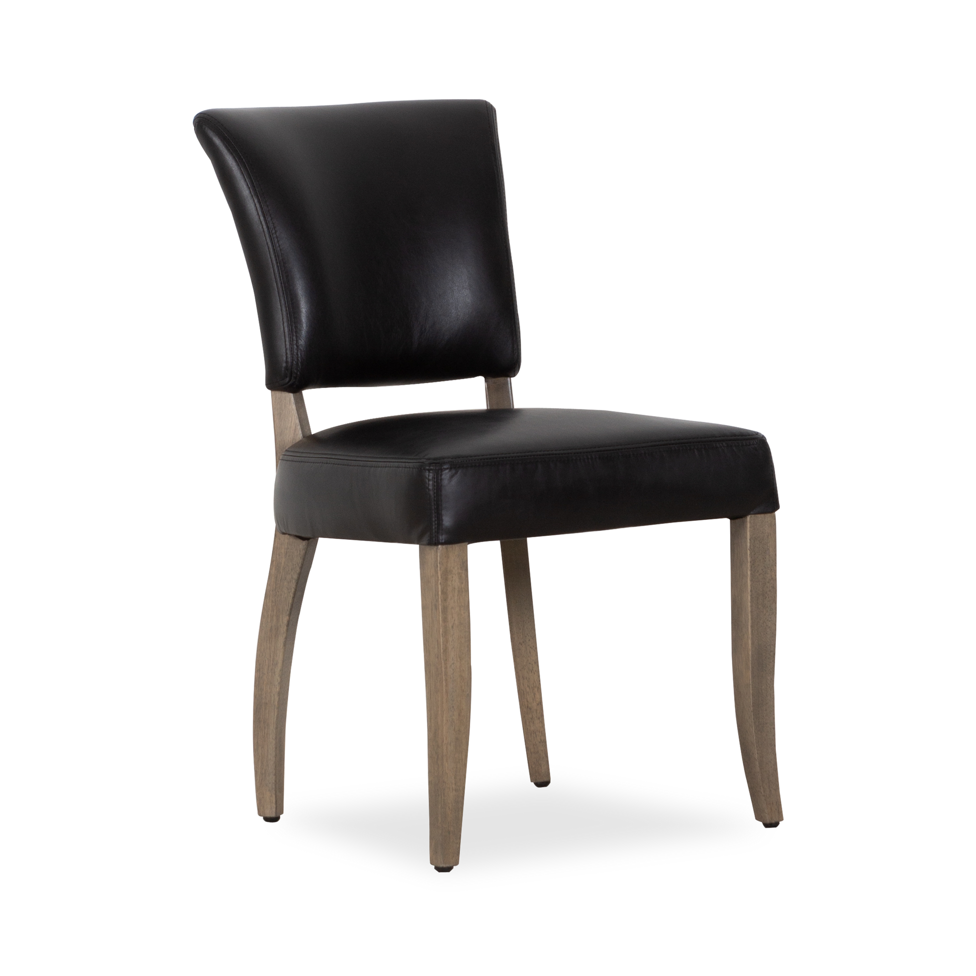The Mimi Dining Side Chair is a reinvention of a classic 1940s French dining chair with stud detailing and tapered wooden legs.